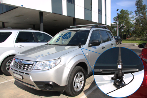 Jeep standing in front of a building with RFI bonnet mount