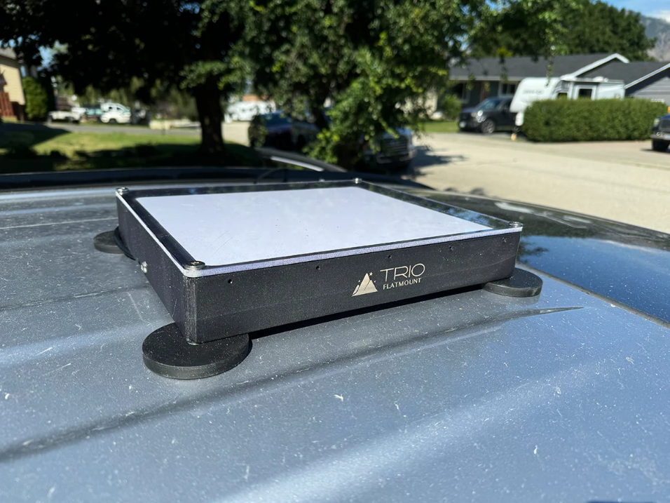 Side view of a Starlink Mini mounted on a surface on a speedmount