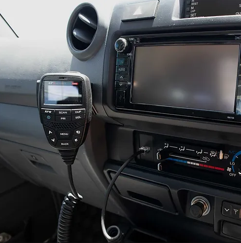 A UHF Handpiece Mounted on A Bracket Beside A Car Display