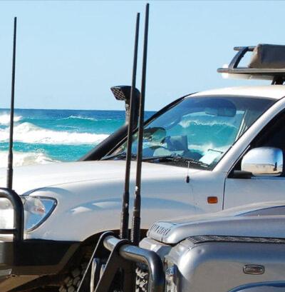 Car beside the sea with radio antenna installed