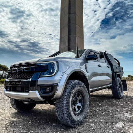 Vehicle in front of a chimney with GMF 4x4 bonnet hinge antenna mount