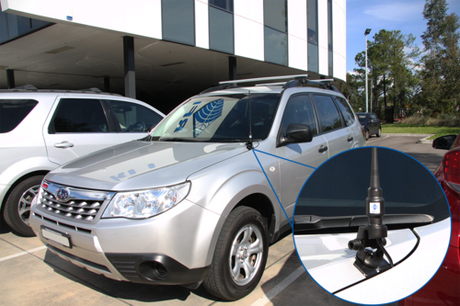 Jeep standing in front of a building with RFI bonnet mount